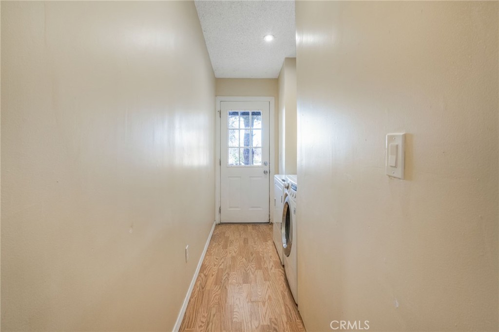 49750 3 Points Road Lancaster, CA 93536 - Photo 16 of 67 a view of hallway with stairs and wooden floor
