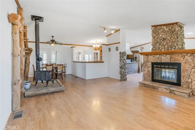 a view of a livingroom with furniture and a fireplace