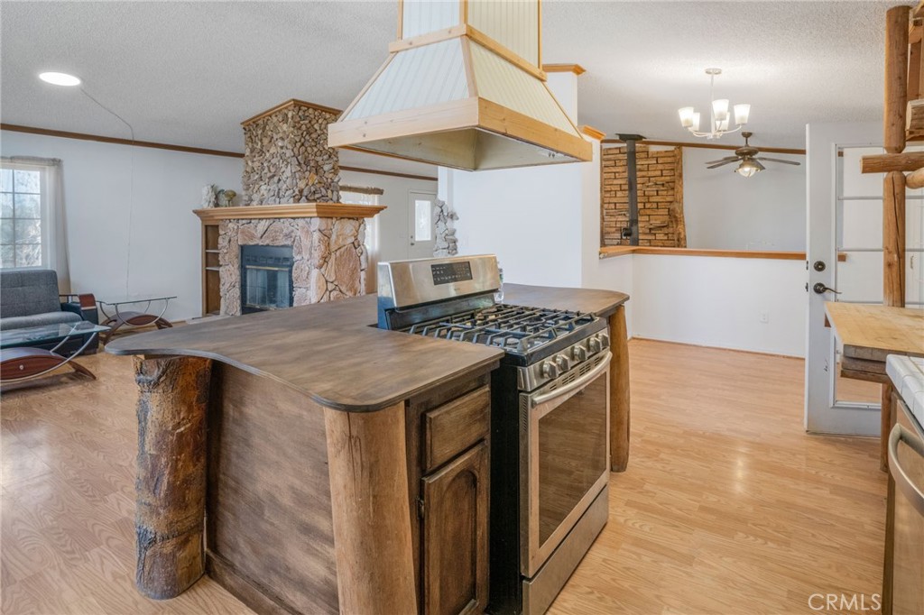 49750 3 Points Road Lancaster, CA 93536 - Photo 26 of 67 a kitchen with a stove and a table