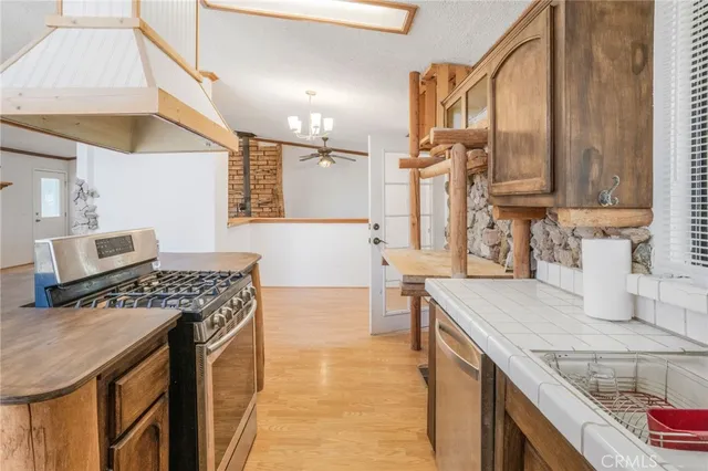 a view of a patio with a table and chairs under an umbrella