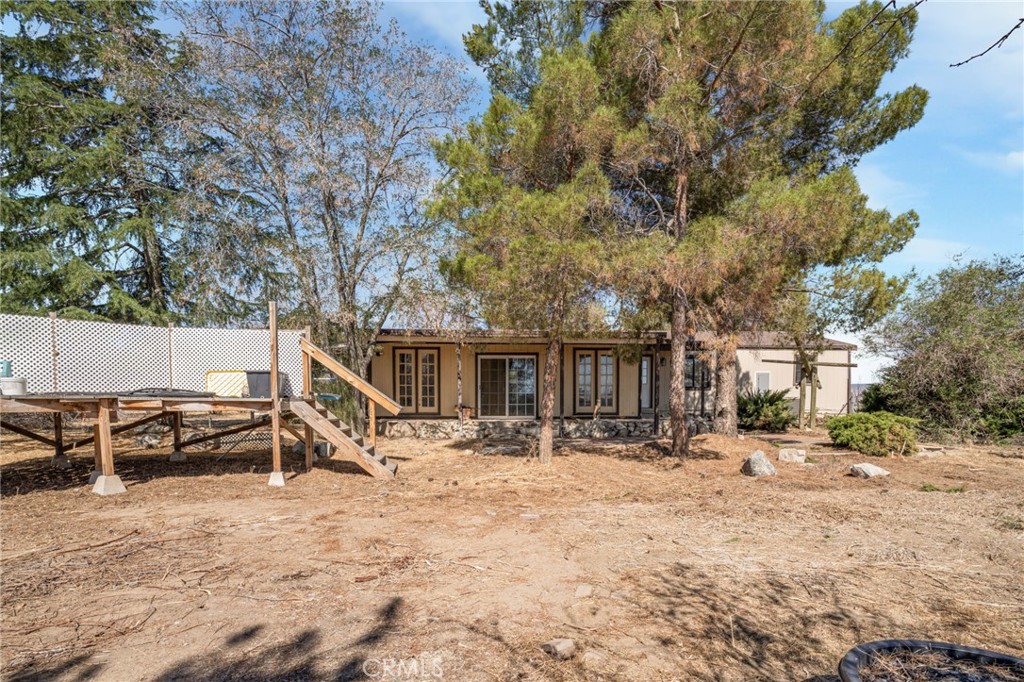 49750 3 Points Road Lancaster, CA 93536 - Photo 33 of 67 a view of a patio with a table and chairs under an umbrella