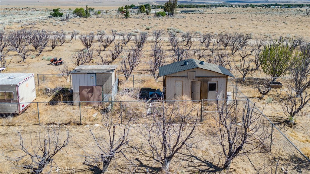 49750 3 Points Road Lancaster, CA 93536 - Photo 65 of 67 a front view of a house with large trees