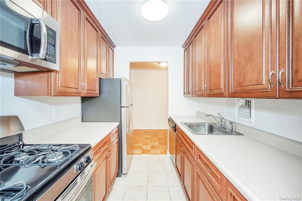 Renovated Kitchen with Stainless Steel Appliances and Subway Tile