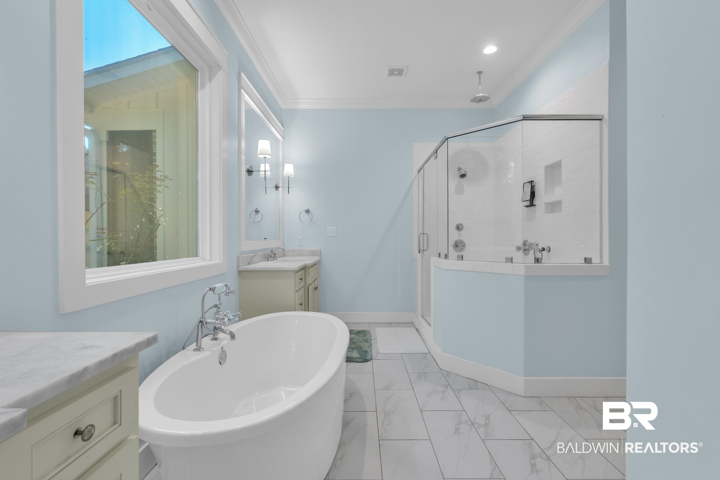 14531 Styx River Road Stapleton, AL 36578 - Photo 23 of 50 Bathroom with a shower stall, vanity, a soaking tub, marble finish flooring, and crown molding