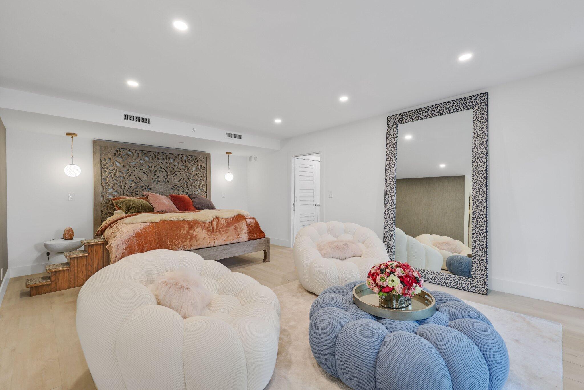 100 Southeast 5th Avenue, Unit 106 Boca Raton, FL 33432 - Photo 23 of 81 a bedroom with two beds and a potted plant