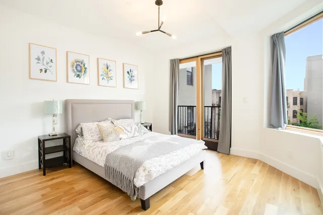 a kitchen with kitchen island a sink appliances and cabinets
