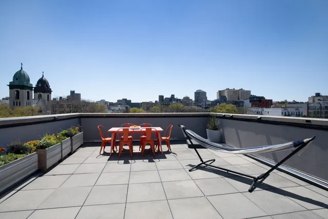 a bathroom with a sink vanity granite tub shower and a mirror