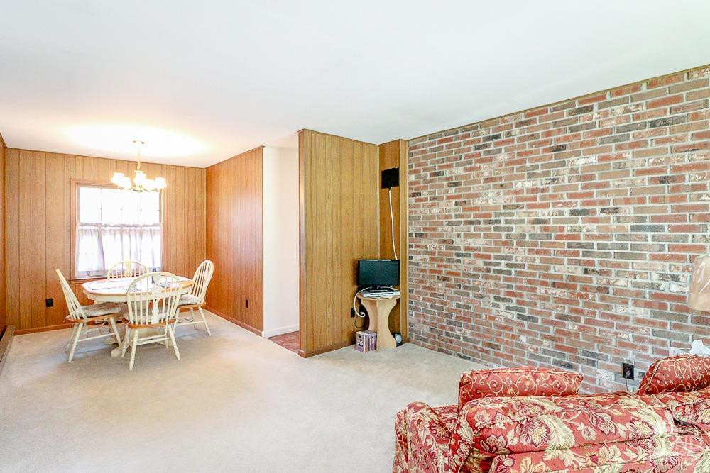 167 Highway 23 Claverack, NY 12513 - Photo 6 of 23 a bedroom with a bed and a chair