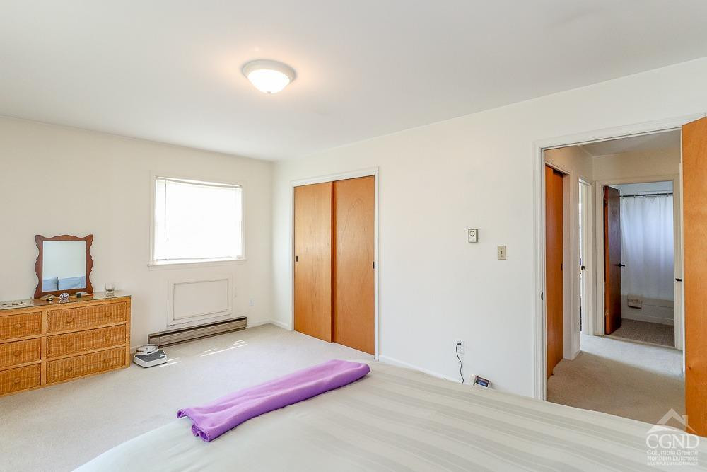 167 Highway 23 Claverack, NY 12513 - Photo 9 of 23 a bedroom with a bed and a window