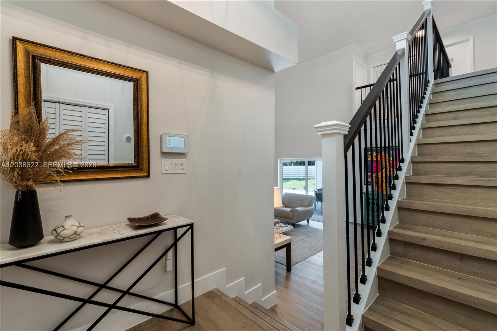 14830 Southwest 149th Street Miami, FL 33196 - Photo 3 of 43 a view of a hallway with wooden floor and entryway