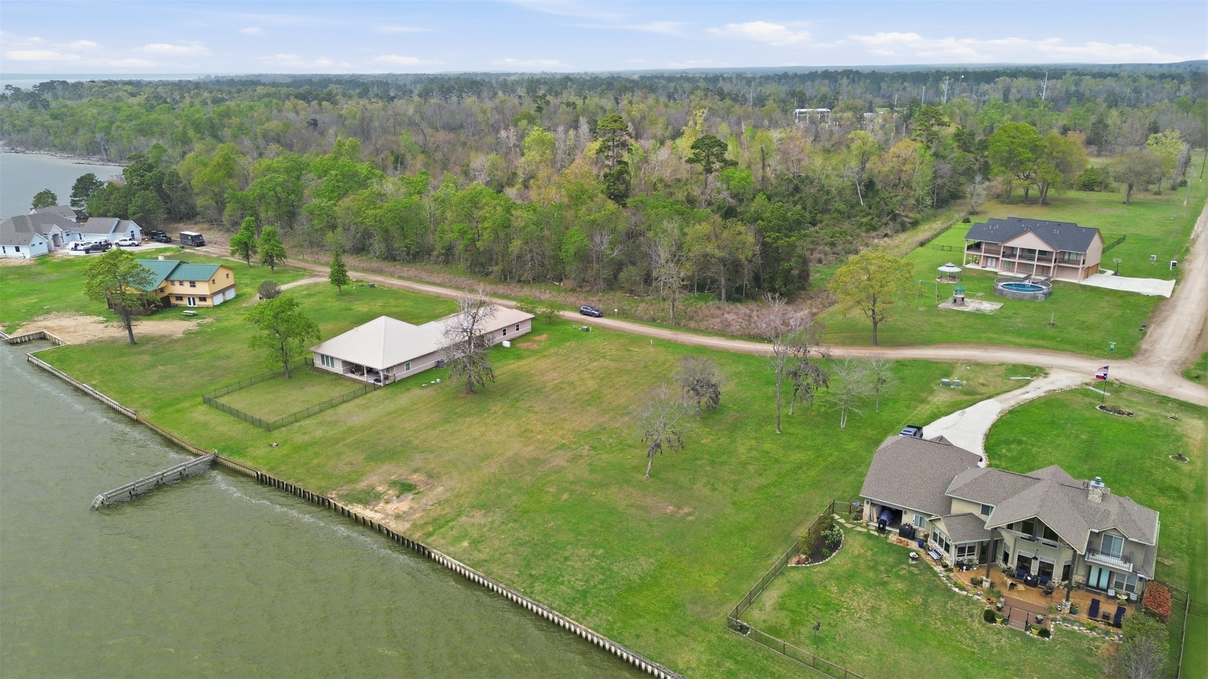 Lot 89 Bridgewater Onalaska, TX 77360 - Photo 4 of 15 a view of a lake with a yard