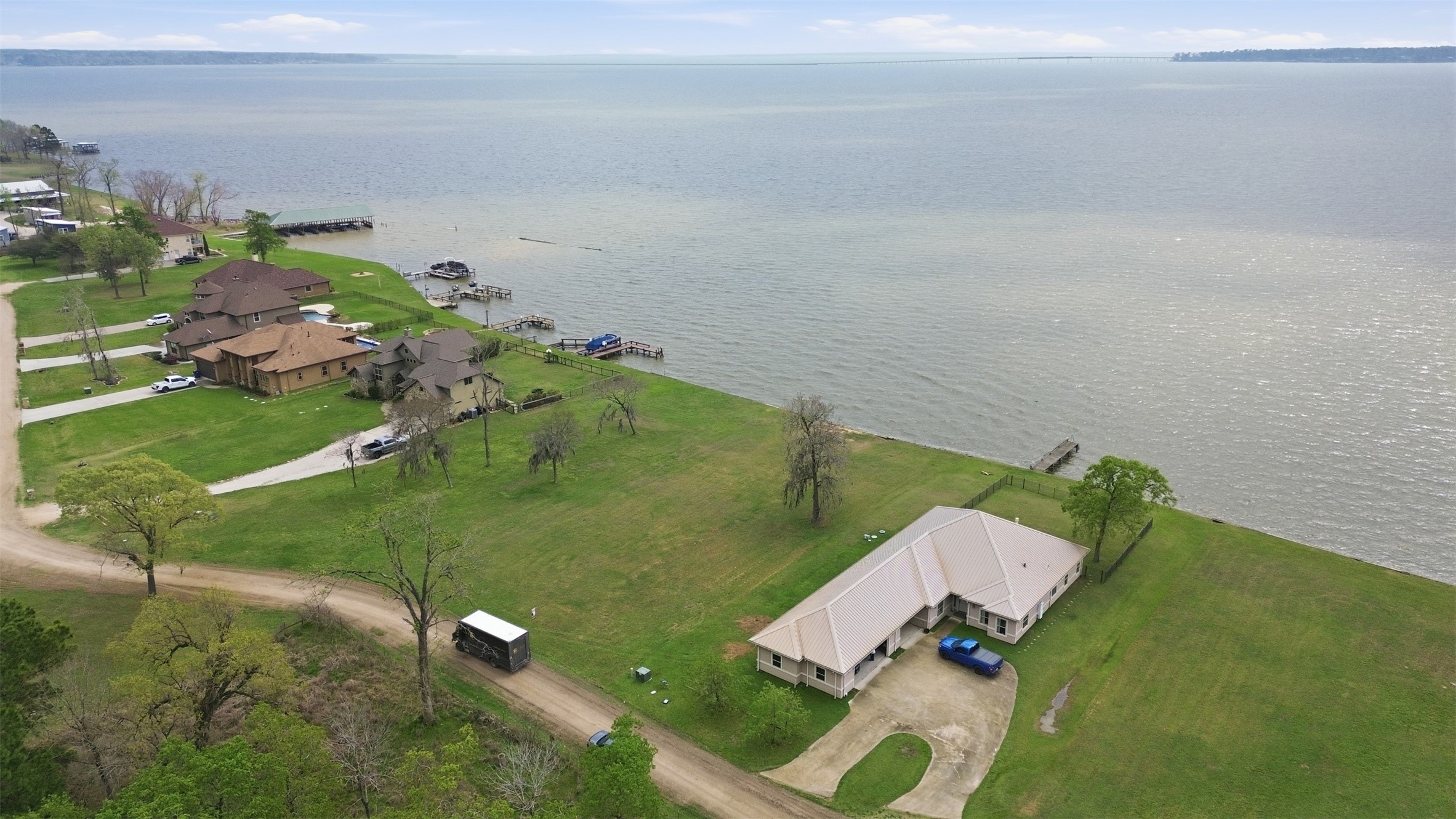 Lot 89 Bridgewater Onalaska, TX 77360 - Photo 8 of 15 an aerial view of a house with a yard and lake view