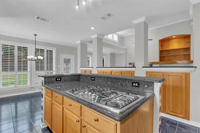 a kitchen with a stove and a sink