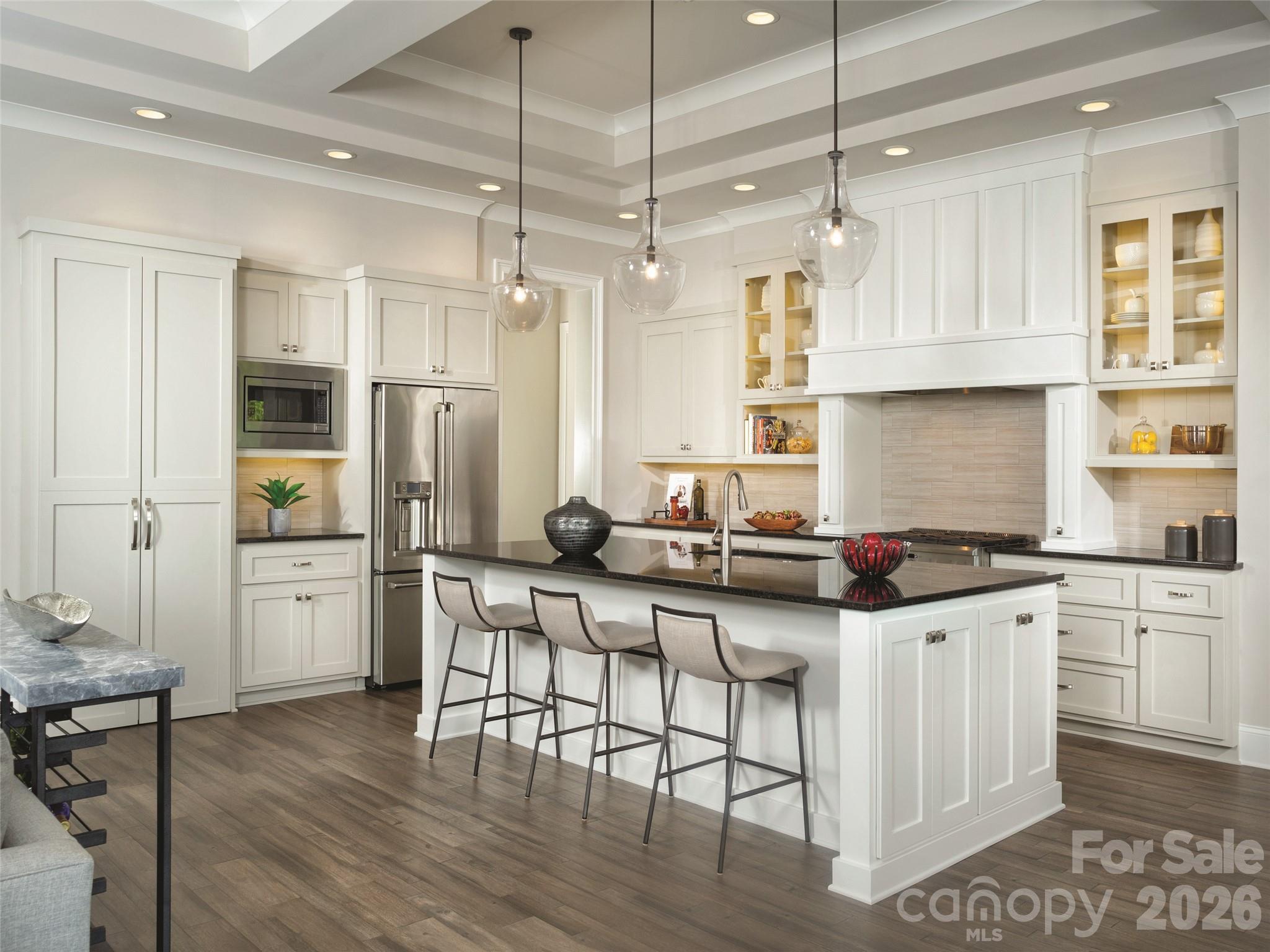 142 Elkton Court Mill Spring, NC 28756 - Photo 5 of 24 a kitchen with a sink a center island cabinets and stainless steel appliances