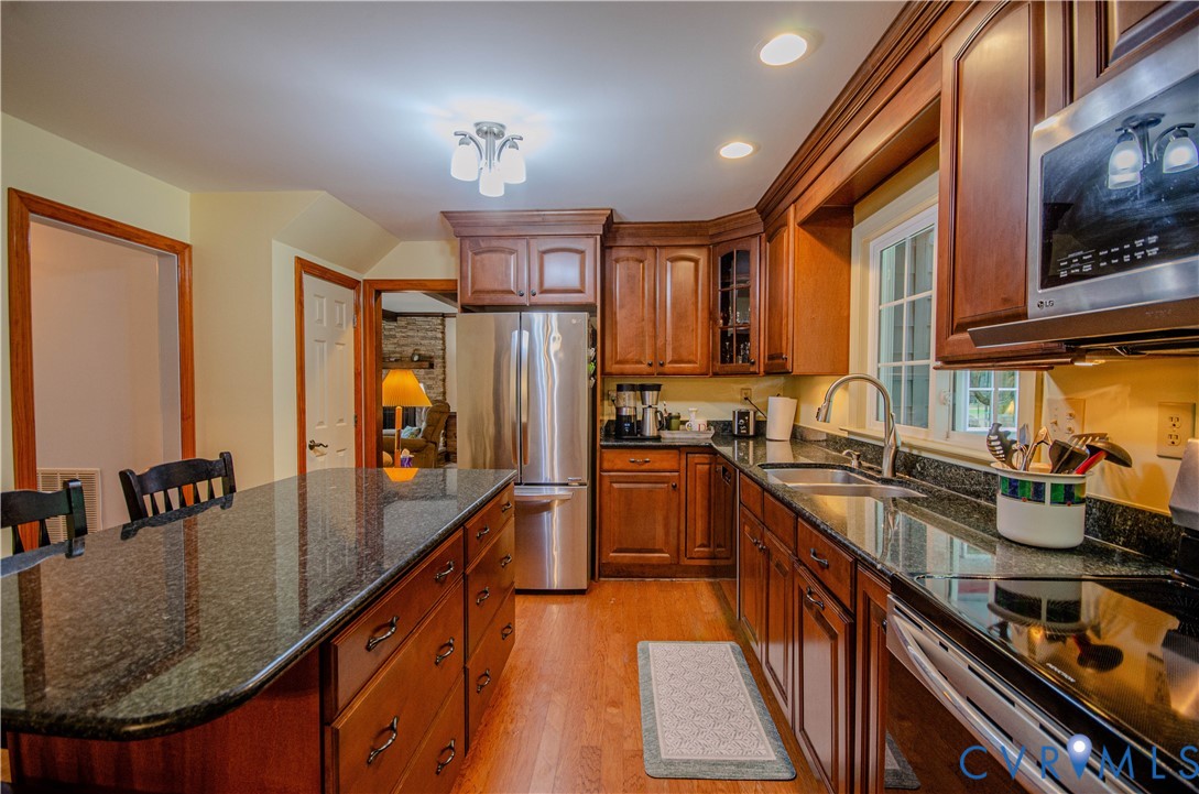 12500 Musical Lane Midlothian, VA 23113 - Photo 14 of 51 Kitchen featuring an extensive island with dark co