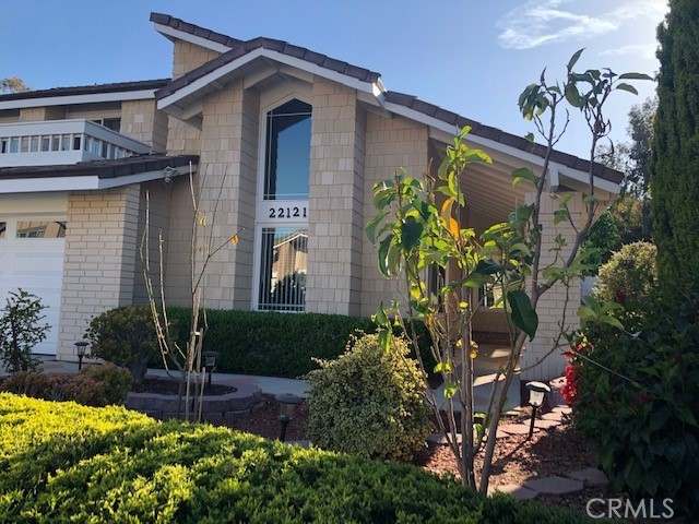 22121 Apache Drive Lake Forest, CA 92630 - Photo 4 of 5 a front view of a house with a yard