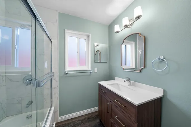 a bathroom with 2 sink and a mirror