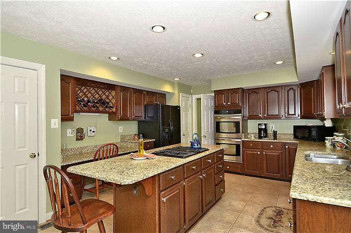 10378 Stansfield Road Laurel, MD 20723 - Photo 13 of 30 Granite counters,centre island w/ cooktop