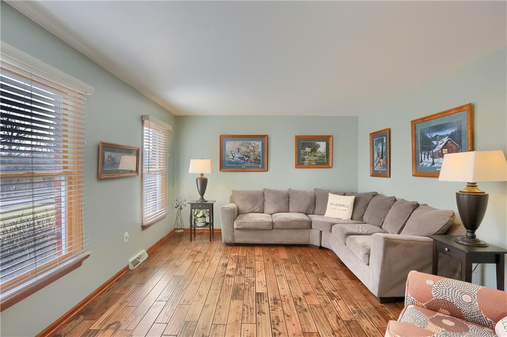 365 Fanker Road Harmony, PA 16037 - Photo 7 of 50 Large living room graced with hardwood. Can double as a home office.