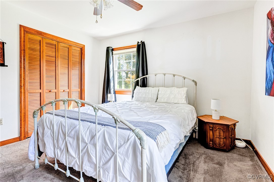 3050 Rose Mount Road Walkerton, VA 23177 - Photo 12 of 35 Bedroom with carpet floors, ceiling fan, and a clo