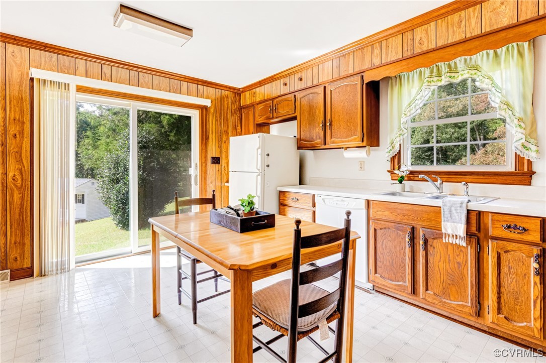 3050 Rose Mount Road Walkerton, VA 23177 - Photo 18 of 35 Kitchen with crown molding, wood walls, white appl