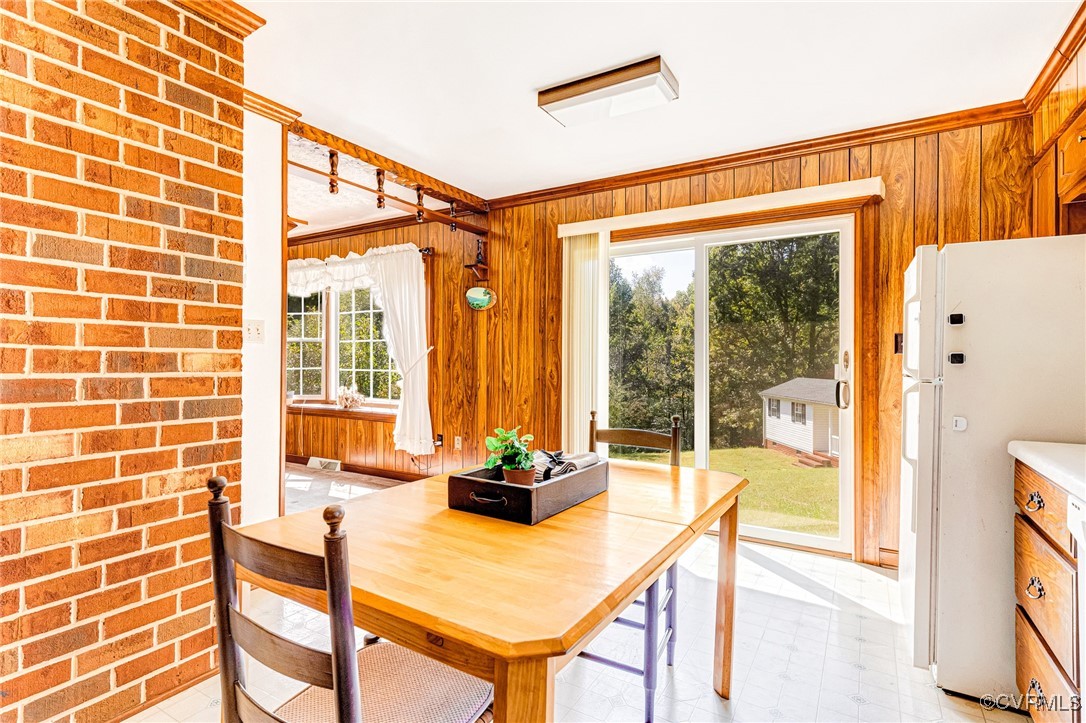 3050 Rose Mount Road Walkerton, VA 23177 - Photo 19 of 35 Dining room with wood walls and crown molding