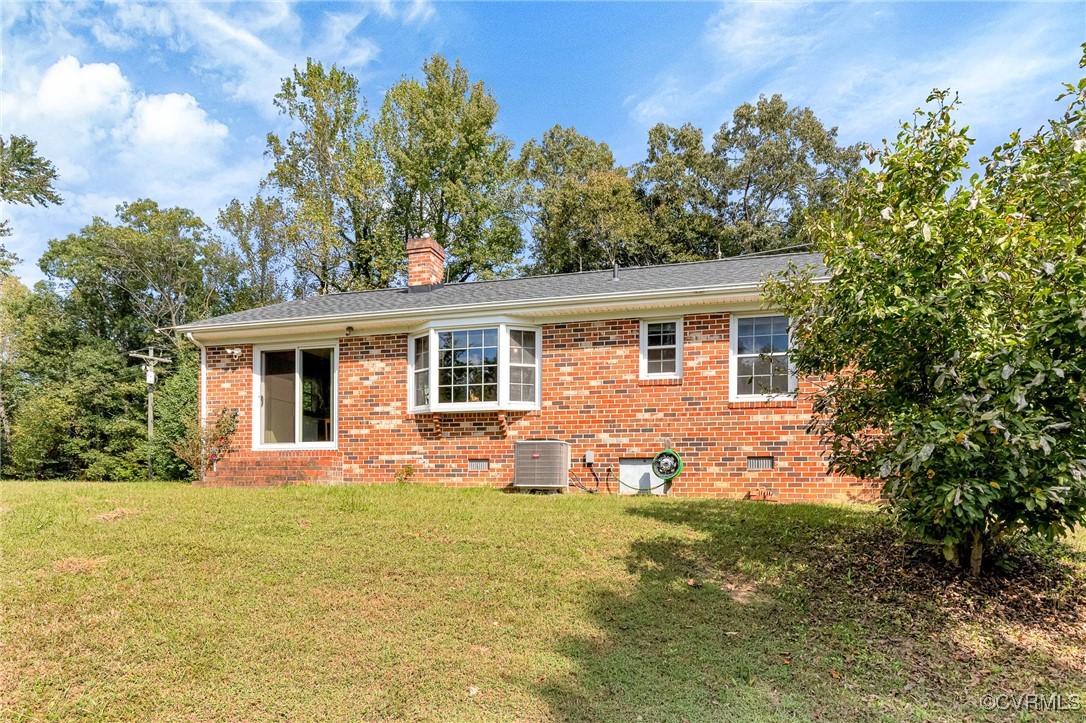 3050 Rose Mount Road Walkerton, VA 23177 - Photo 25 of 35 Rear view of property with cooling unit and a yard