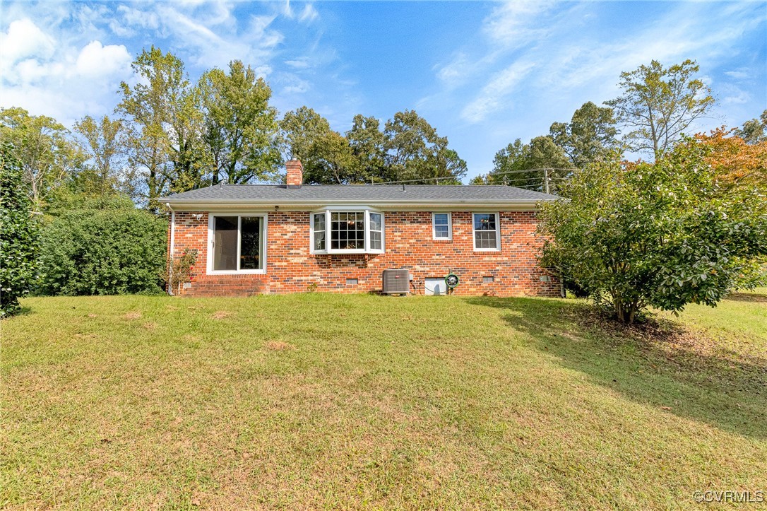 3050 Rose Mount Road Walkerton, VA 23177 - Photo 26 of 35 Rear view of property with central AC unit and a y