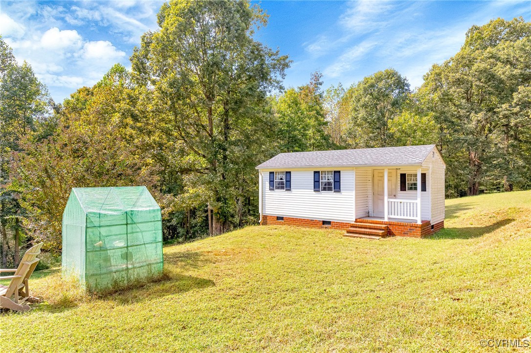 3050 Rose Mount Road Walkerton, VA 23177 - Photo 27 of 35 View of front of house with a storage shed and a f