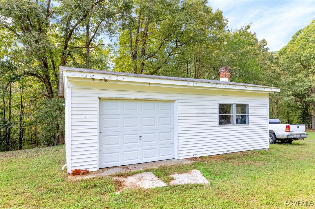 3050 Rose Mount Road Walkerton, VA 23177 - Photo 30 of 35 Garage featuring a yard