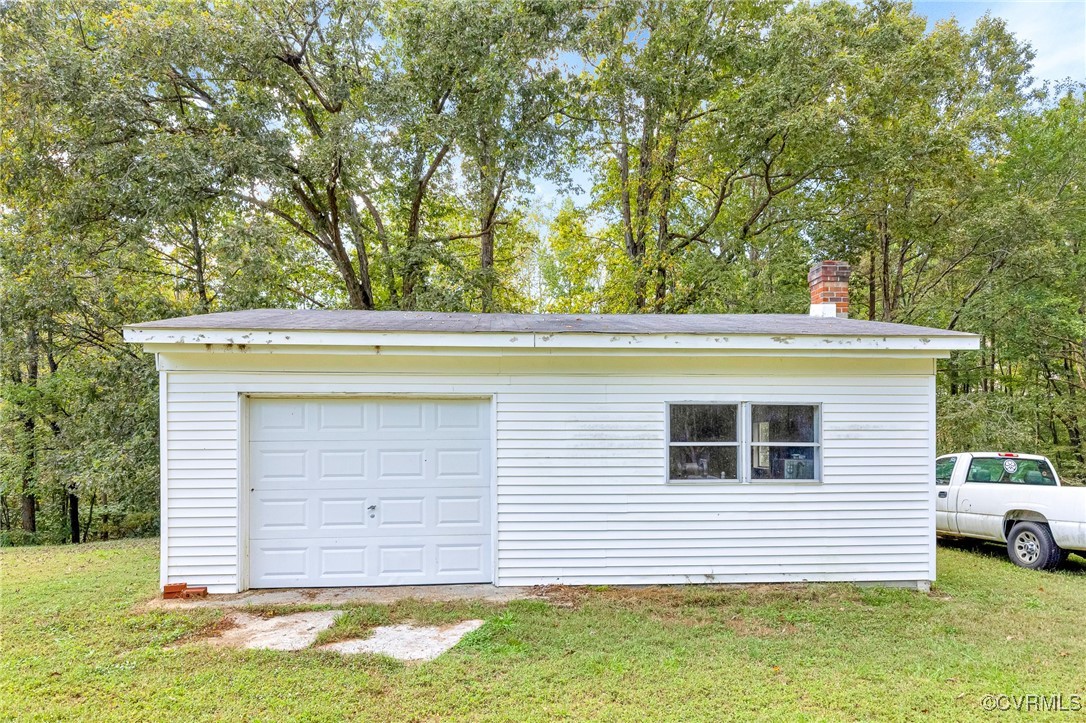 3050 Rose Mount Road Walkerton, VA 23177 - Photo 31 of 35 Garage featuring a lawn