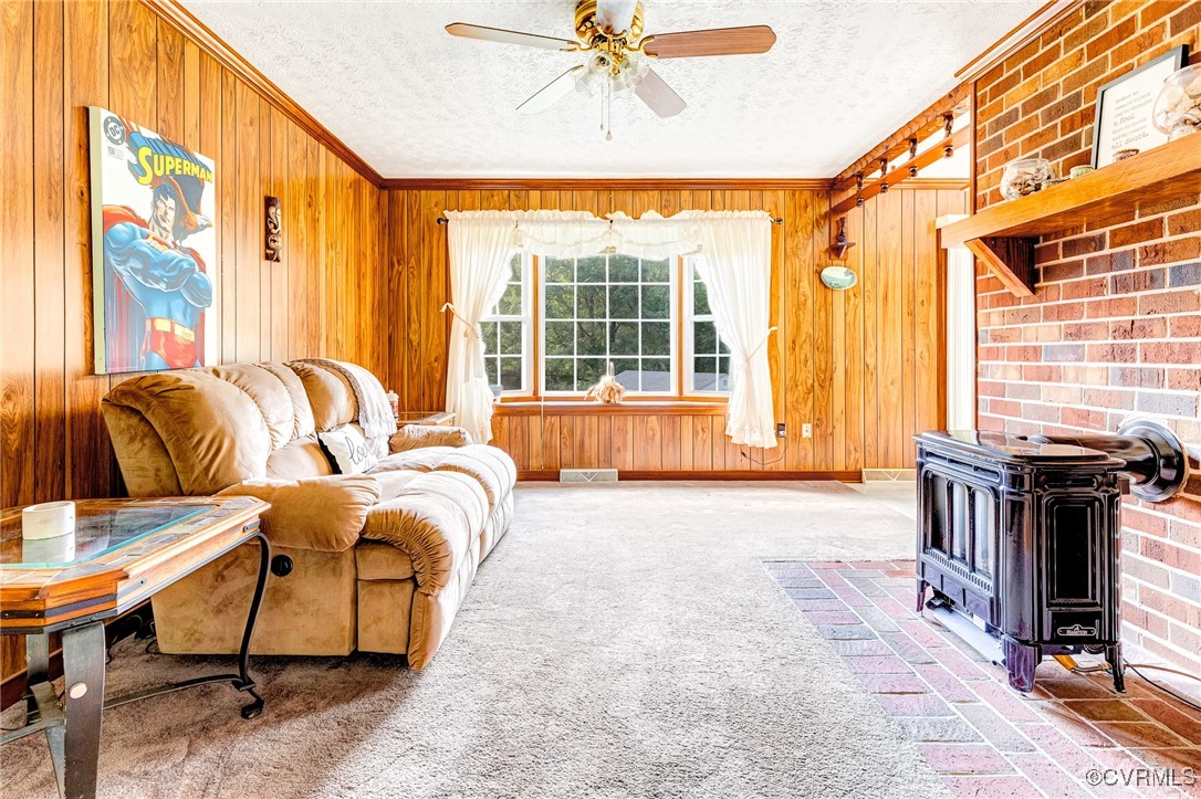 3050 Rose Mount Road Walkerton, VA 23177 - Photo 5 of 35 Carpeted living room featuring ceiling fan, a text