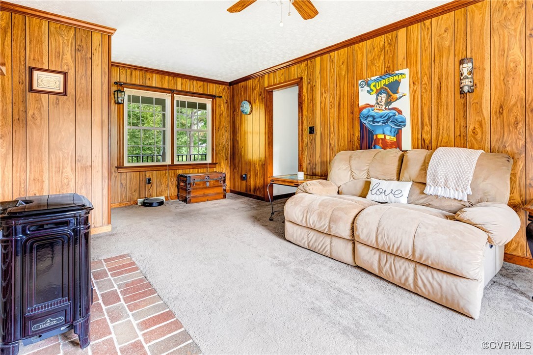 3050 Rose Mount Road Walkerton, VA 23177 - Photo 8 of 35 Carpeted living room featuring crown molding, wood