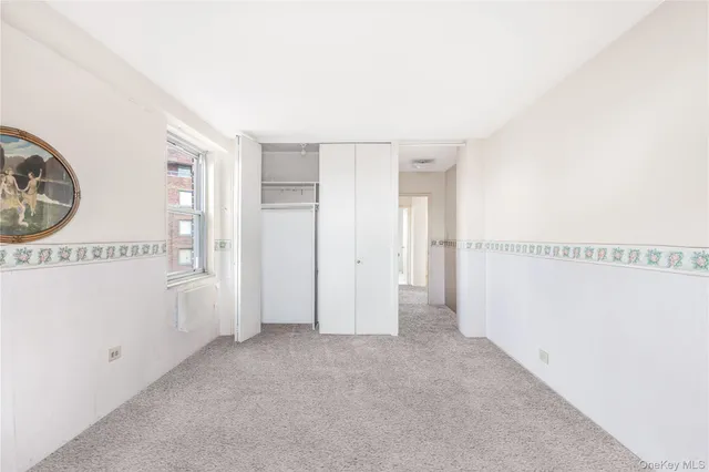 a view of a hallway with closet