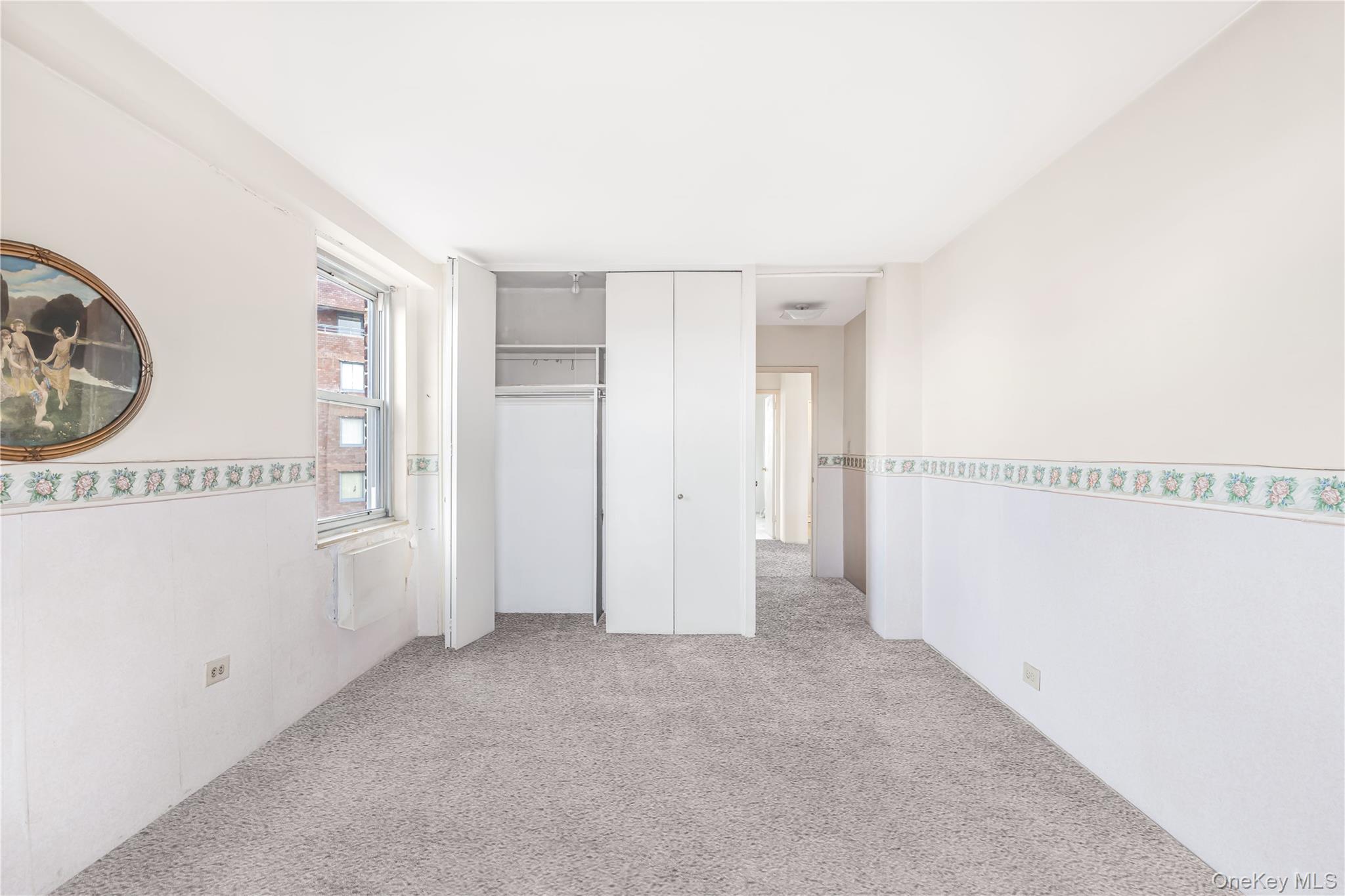 61-25 97th Street, Unit 15F Queens, NY 11374 - Photo 15 of 26 a view of a hallway with closet