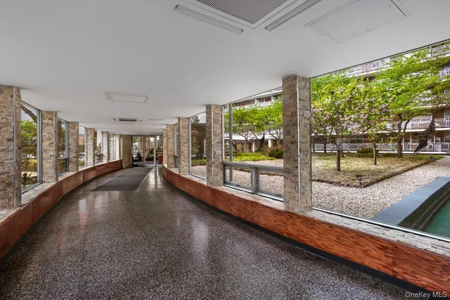 a swimming pool with outdoor seating and yard