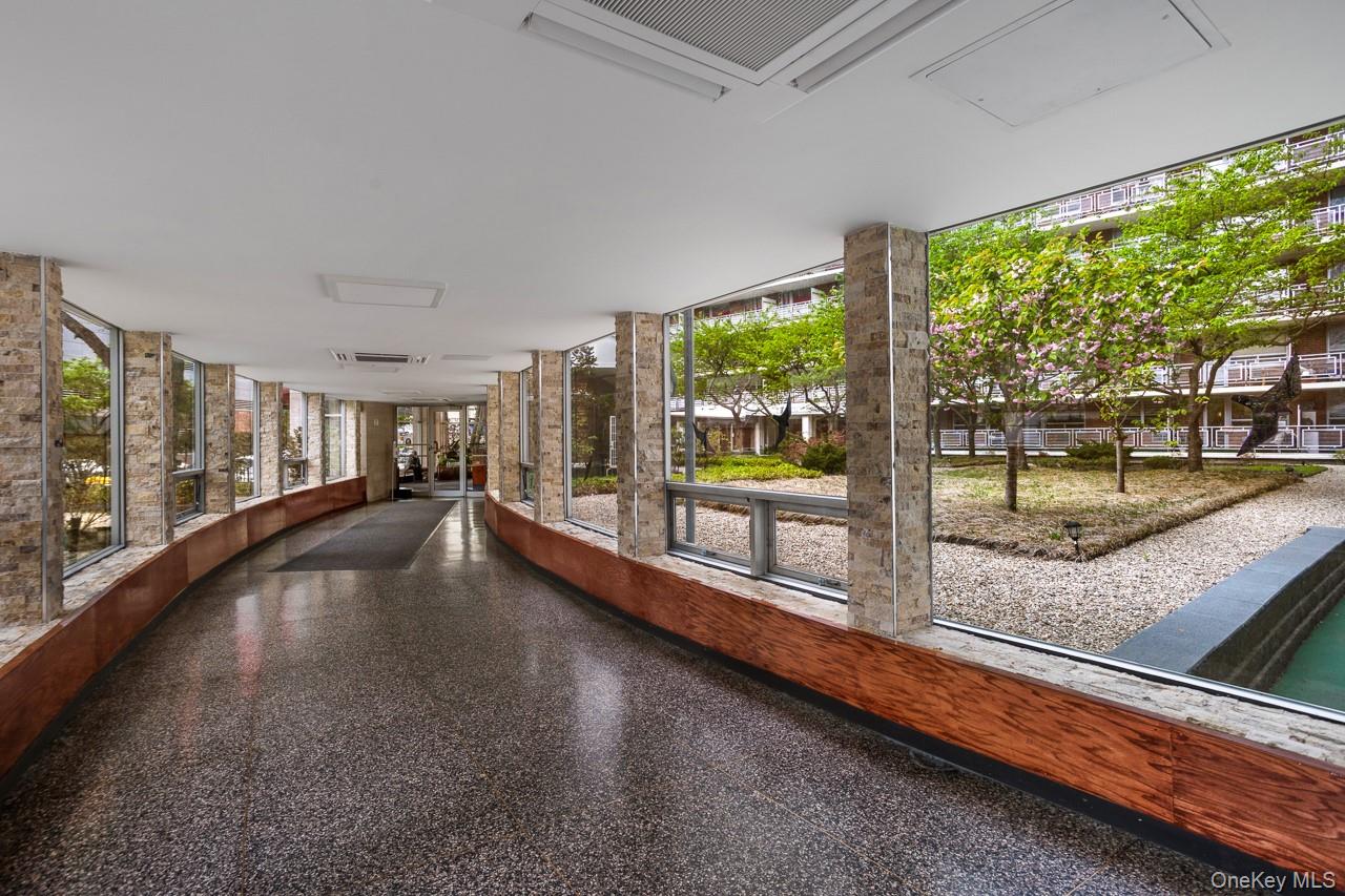 61-25 97th Street, Unit 15F Queens, NY 11374 - Photo 5 of 26 a swimming pool with outdoor seating and yard