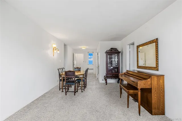 a view of a livingroom with furniture and window