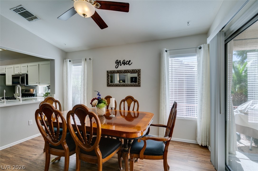 2187 Chapman Ranch Drive Henderson, NV 89012 - Photo 7 of 26 This inviting dining area features elegant flooring and abundant natural light.