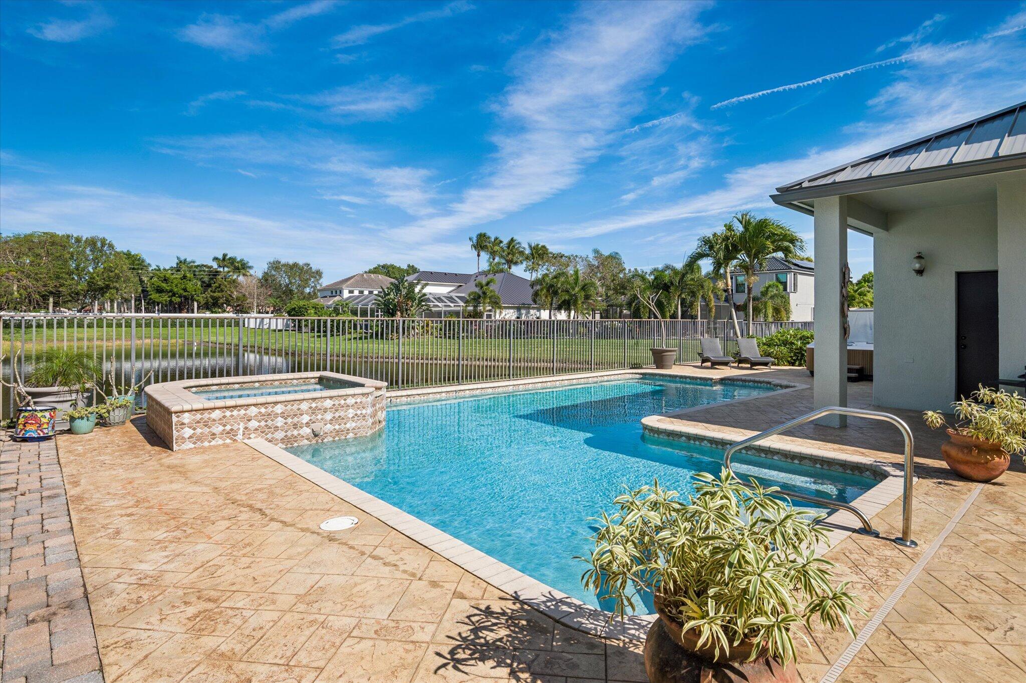 7299 Serrano Terrace Delray Beach, FL 33446 - Photo 31 of 39 a view of a swimming pool with a patio