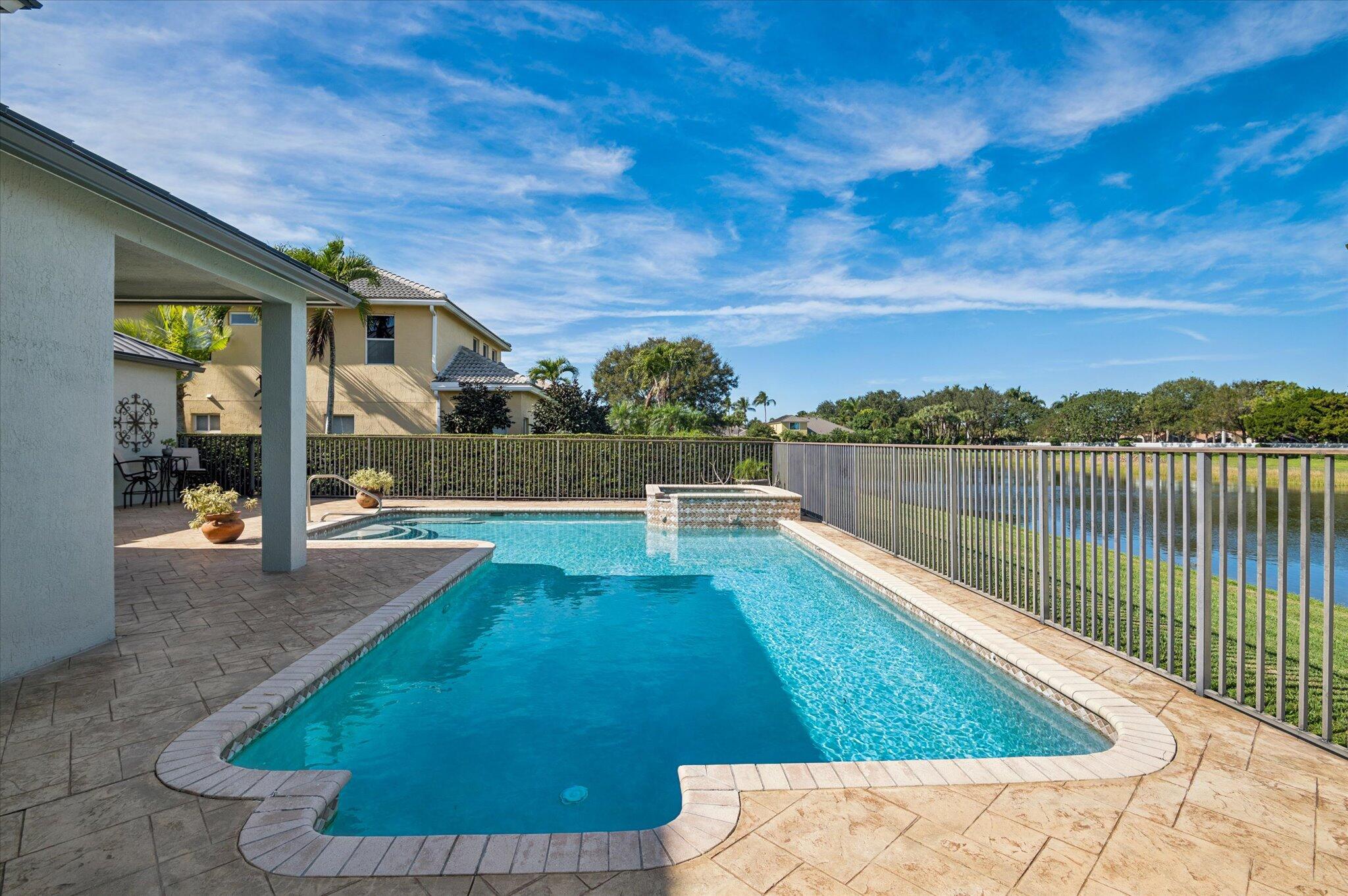 7299 Serrano Terrace Delray Beach, FL 33446 - Photo 32 of 39 a view of a swimming pool with an outdoor seating