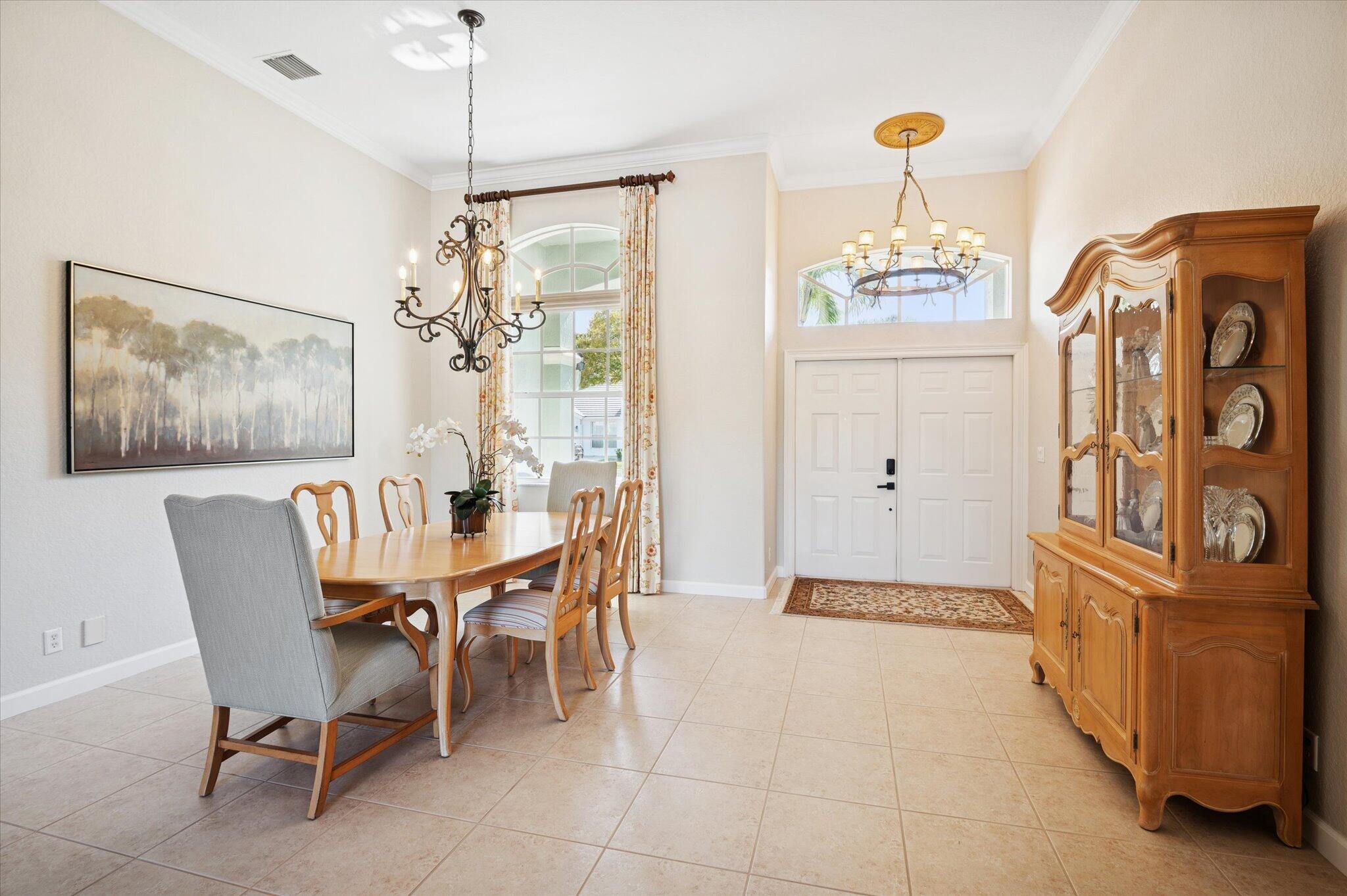 7299 Serrano Terrace Delray Beach, FL 33446 - Photo 9 of 39 a dining room with furniture and window