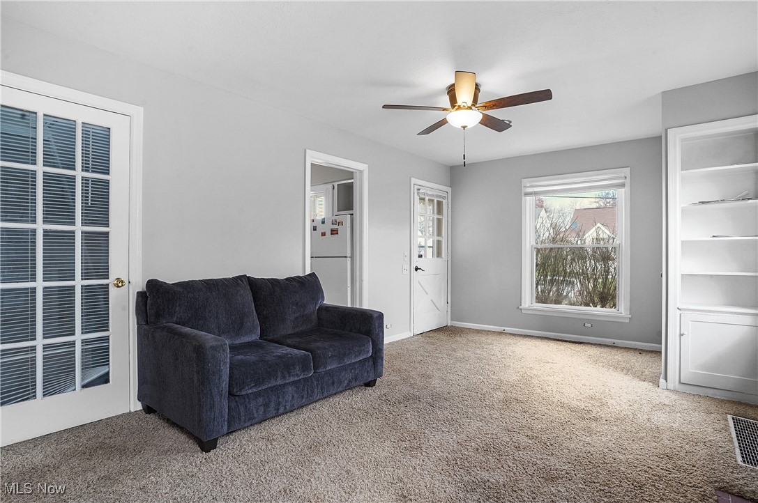 3206 9th Street Northwest Canton, OH 44708 - Photo 14 of 32 Living room with carpet flooring and ceiling fan