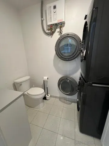 a bathroom with a toilet a sink and a mirror