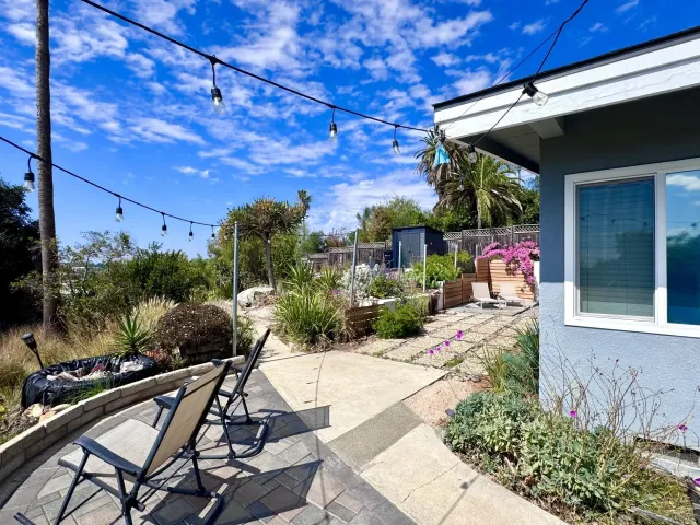 a view of swimming pool with sitting area