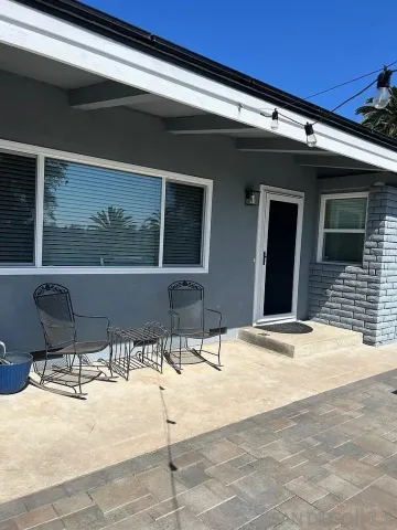 a house with a bench in patio