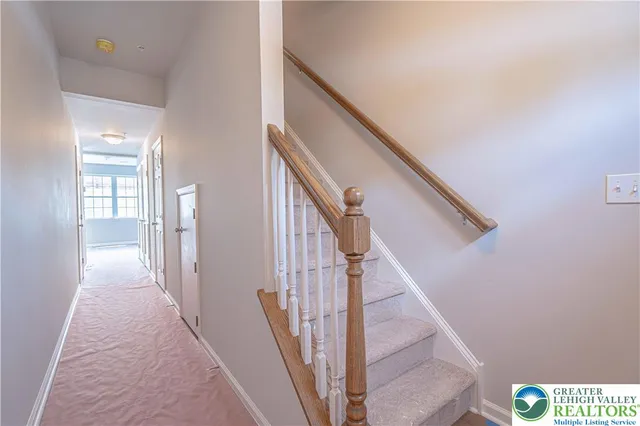 a view of a hallway with staircase