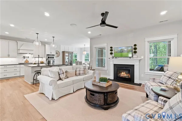 a living room with furniture and a fireplace