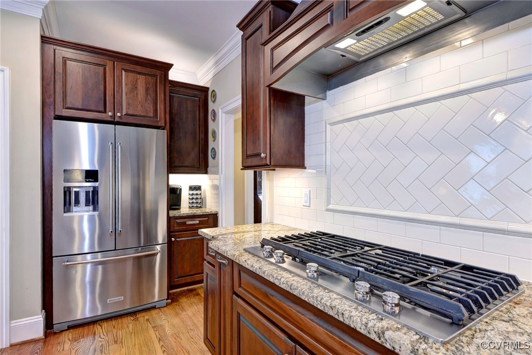 104 Edenbridge Williamsburg, VA 23188 - Photo 12 of 50 a kitchen with stainless steel appliances granite countertop a refrigerator and a stove top oven