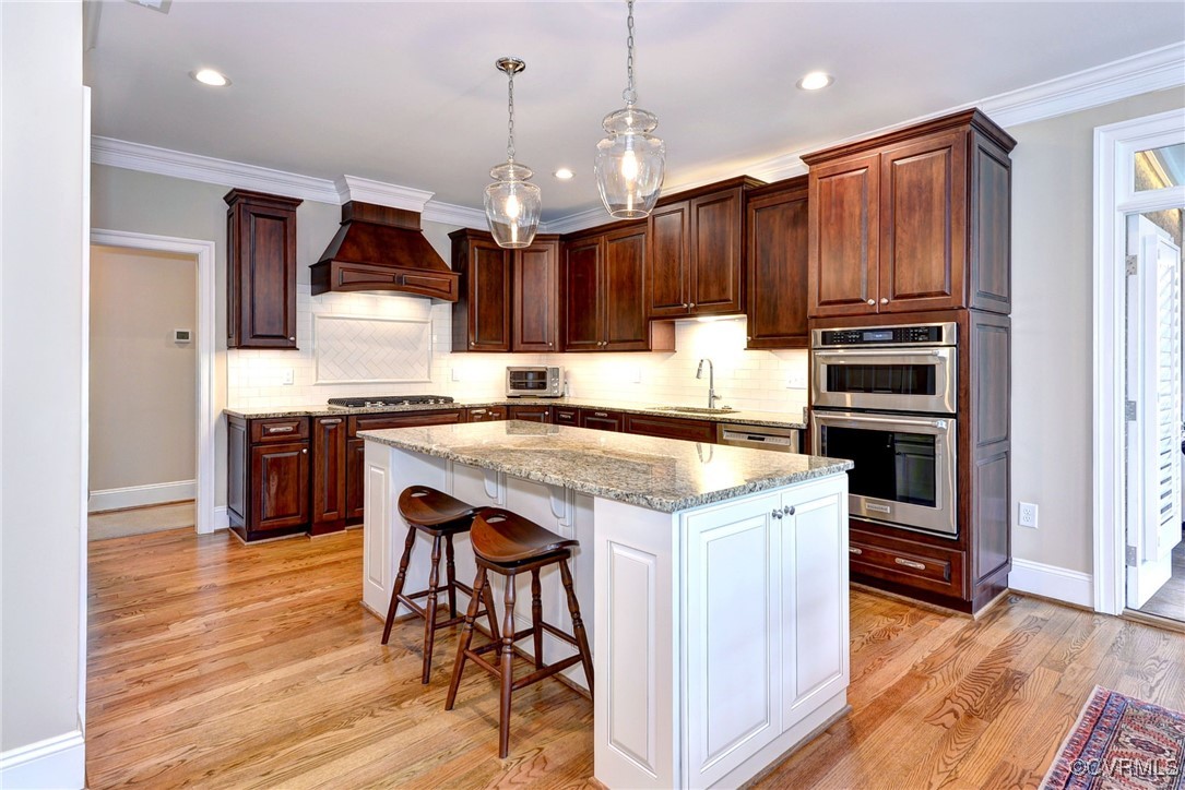 104 Edenbridge Williamsburg, VA 23188 - Photo 15 of 50 a kitchen with a stove a sink and a refrigerator